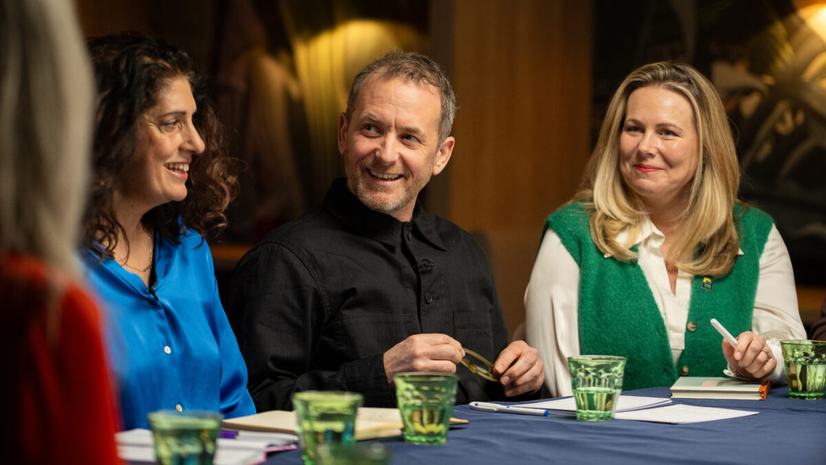 A close up of the roundtable discussion, with people smiling at each other.