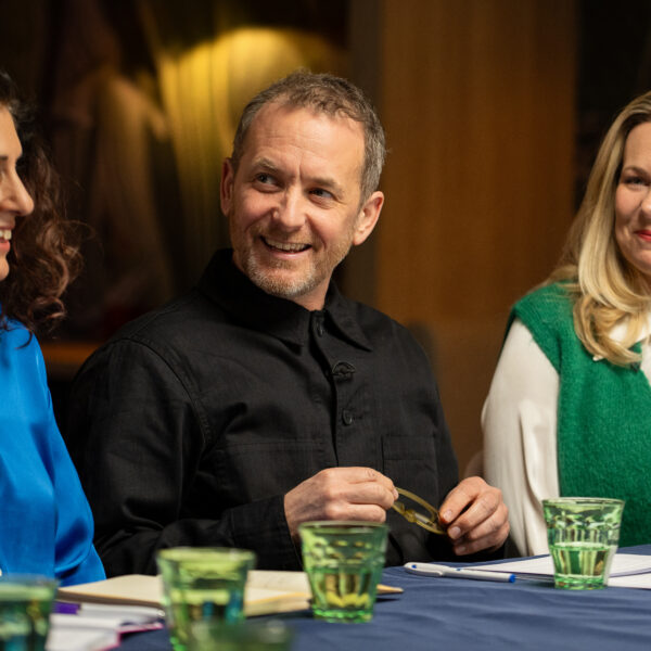 A close up of the roundtable discussion, with people smiling at each other.